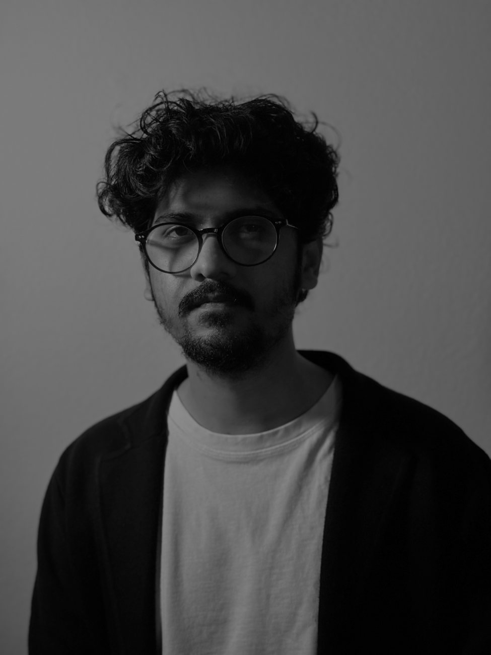 Black-and-white portrait of Varad Sahasrabudhe